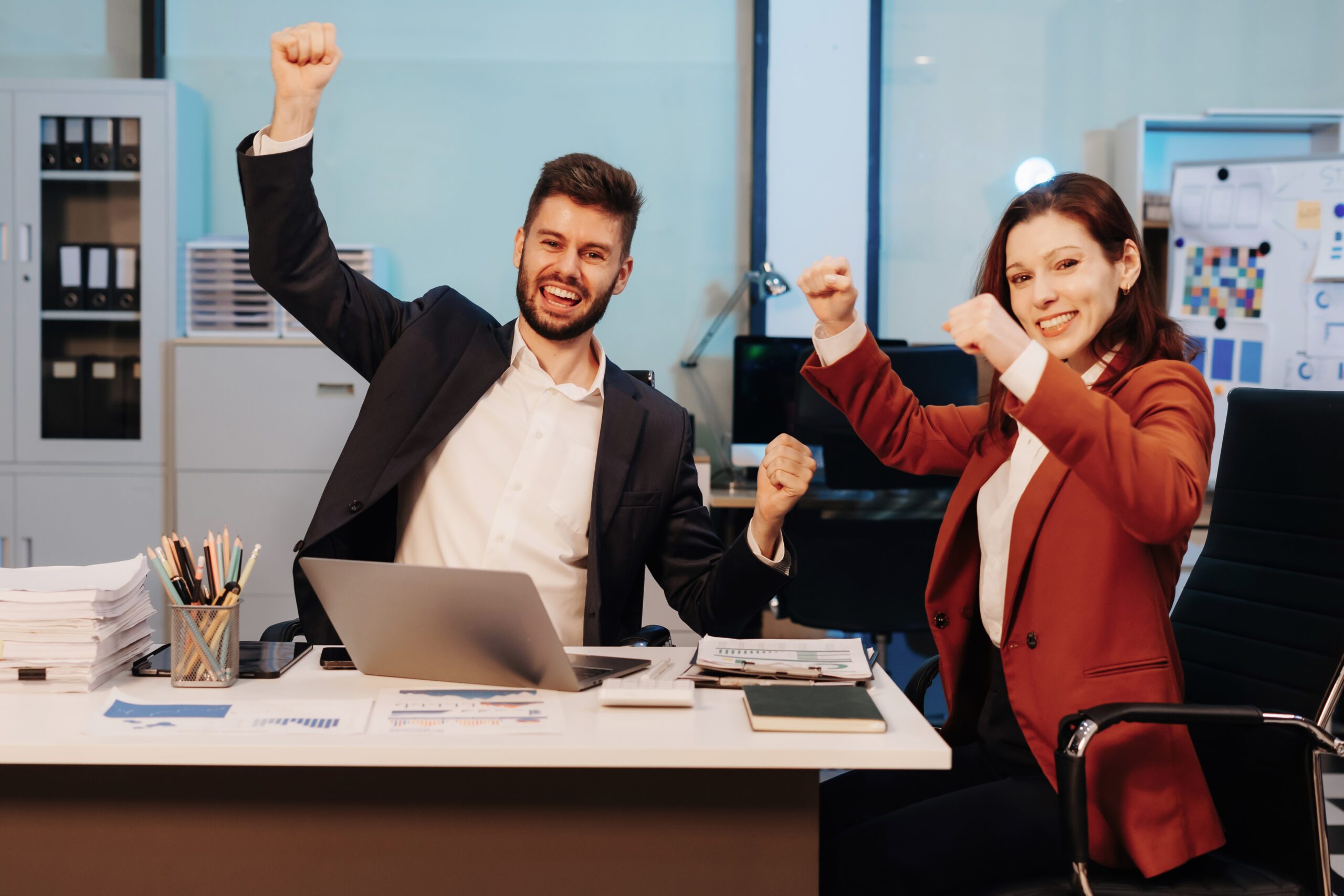International team creative are excited business success. International team creative are excited business success with inspiration from their excellent financial results that are happy working in a modern office on a computer.